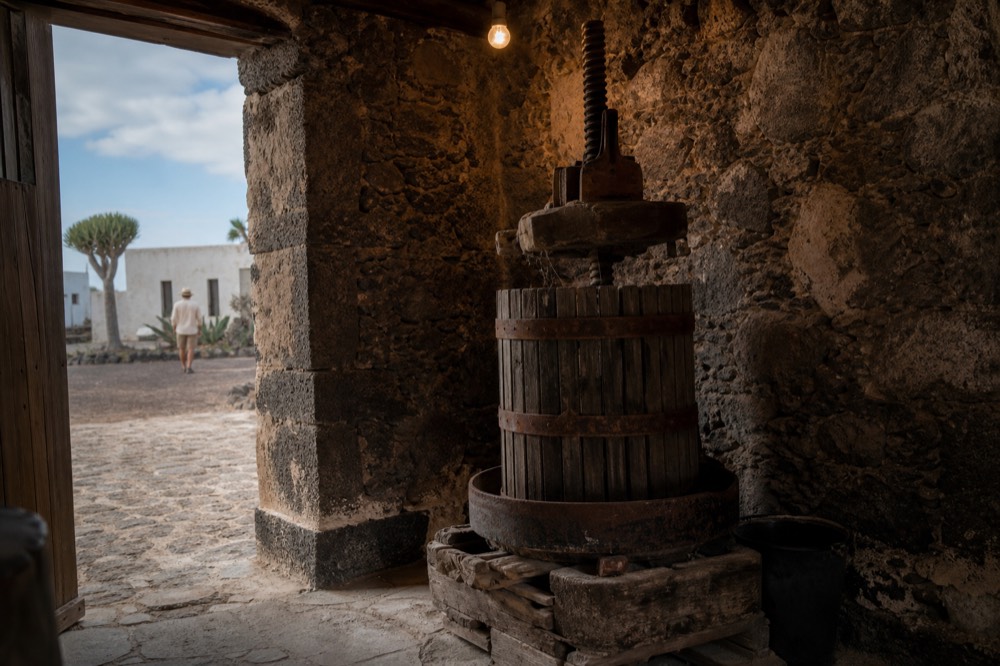 Old wine press and stone cellar interior