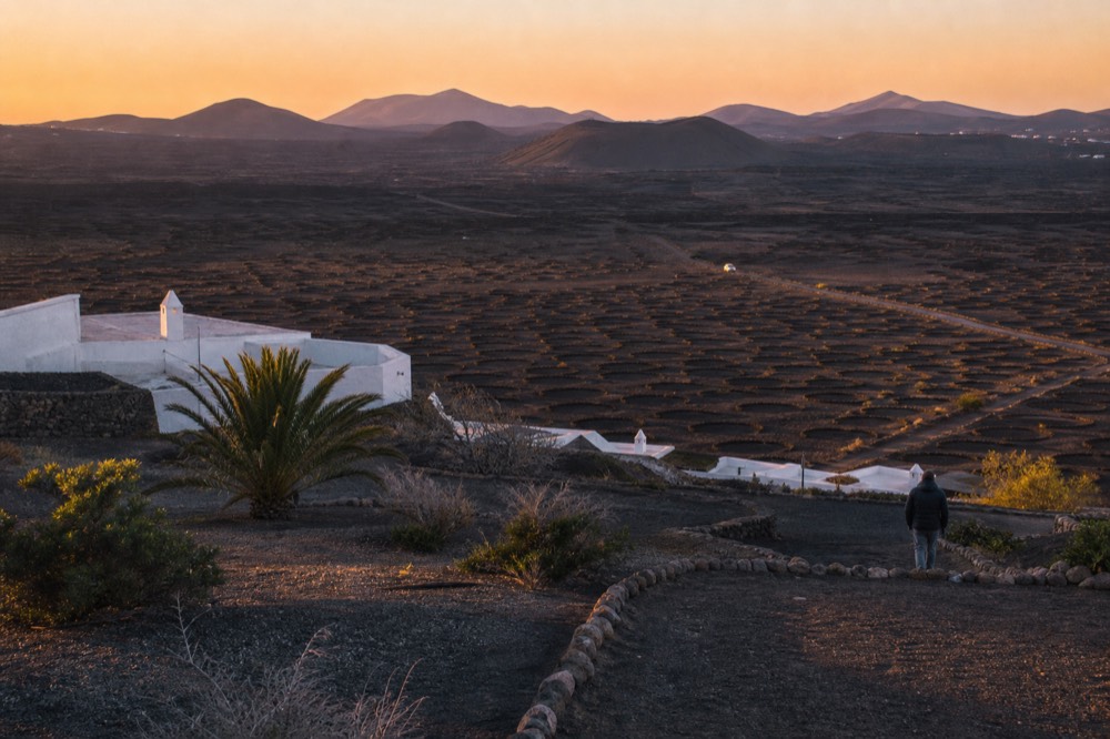 Zoomed out view of La Geria and Timanfaya at sunset