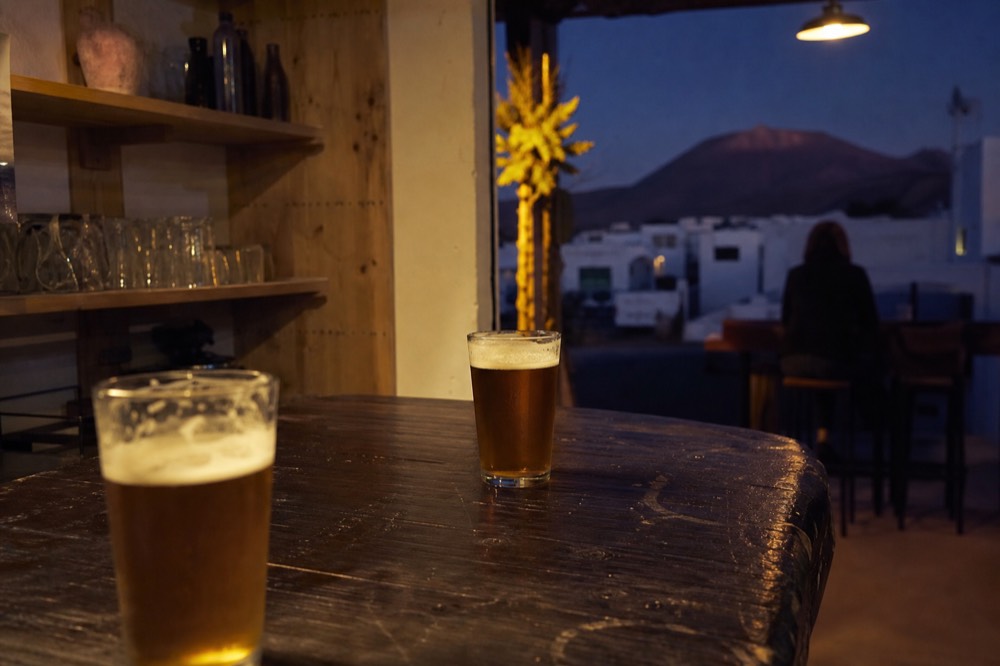 Craft beer glasses beside a brewery taproom counter